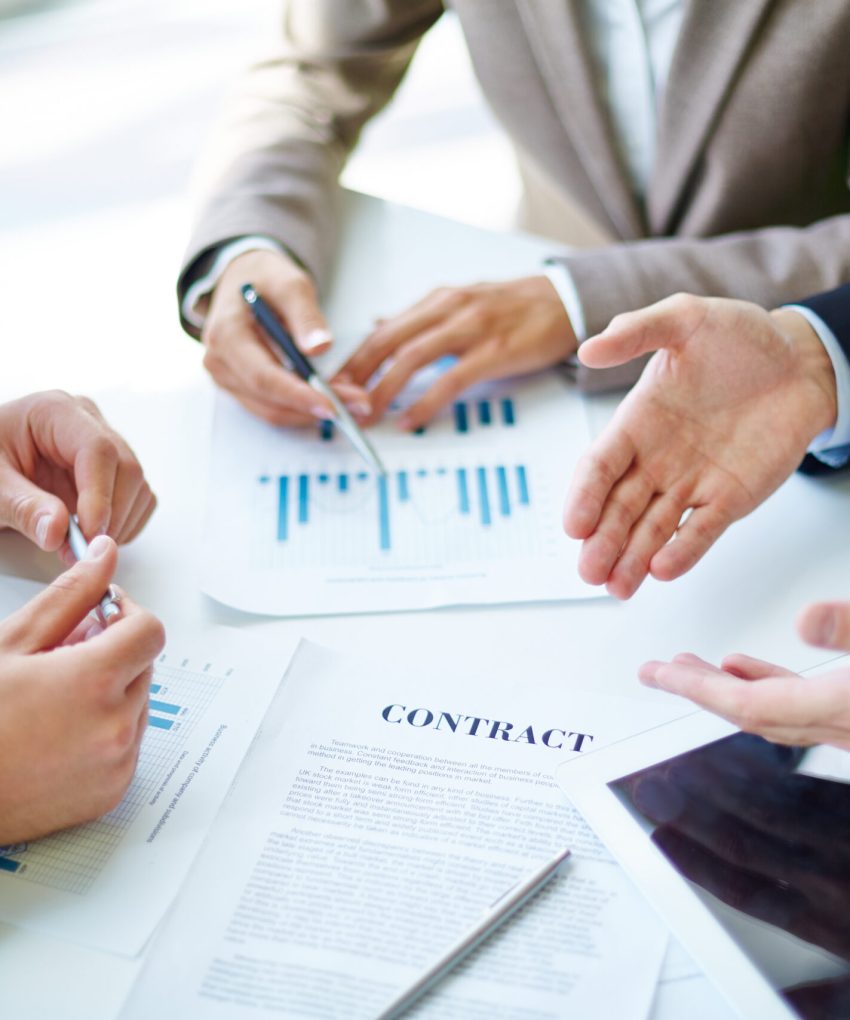 Negotiations Image of business partners hands over business objects on workplace at meeting